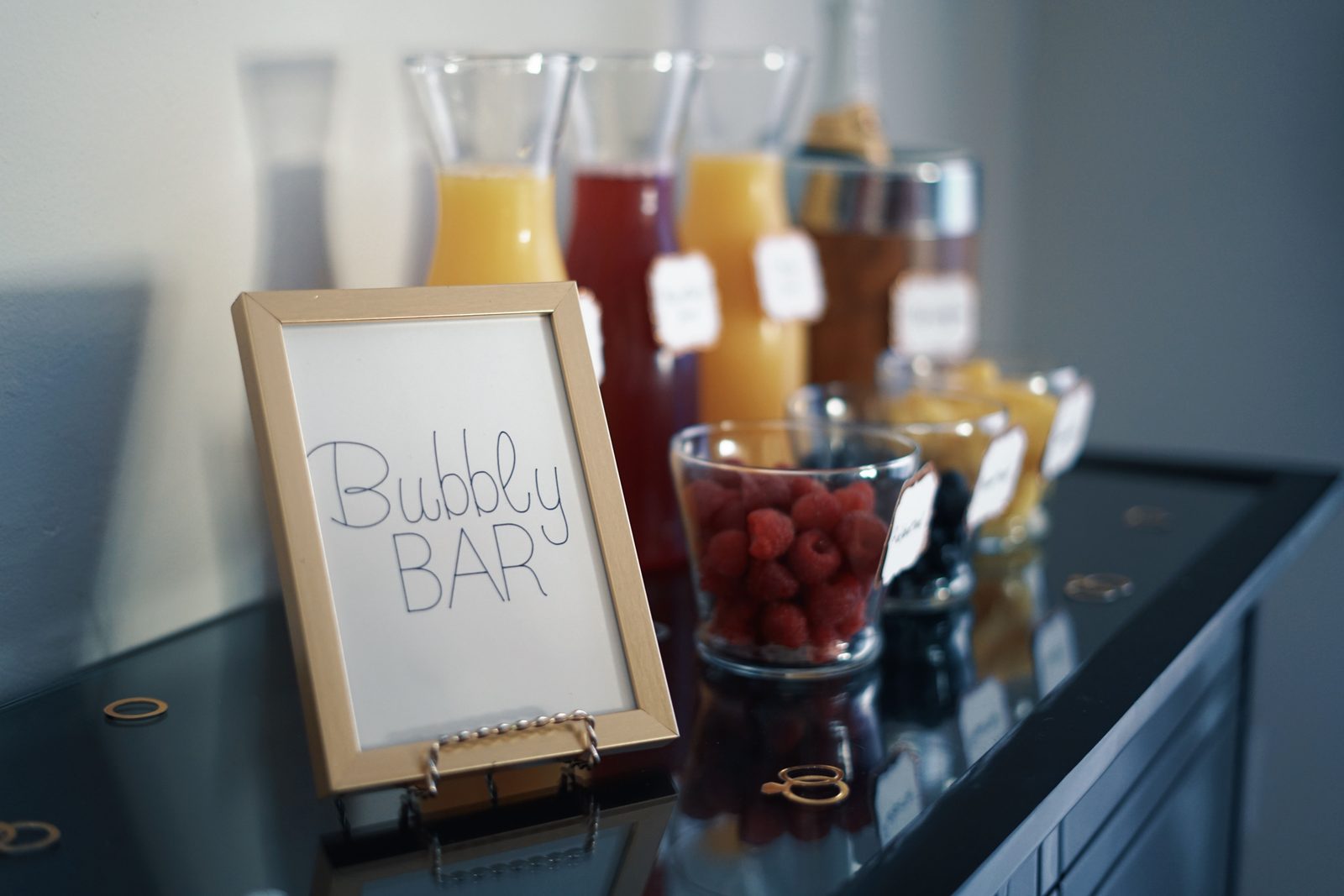 Bubbly bar sign with juice carafes (stock photo)